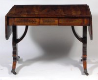 Lot 565 - A Regency rosewood and brass inlaid sofa table,...