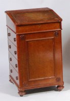 Lot 568 - A circa 1900 walnut campaign Davenport, having...