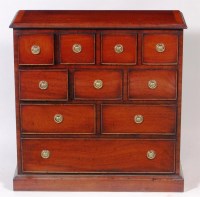 Lot 572 - A mahogany and crossbanded small chest, having...