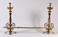 Lot 584 - A pair of heavy brass ecclesiastical firedogs...