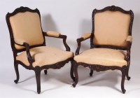 Lot 598 - A pair of Louis XV carved mahogany fauteuil,...
