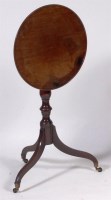 Lot 606 - An early 19th century mahogany tilt-top tripod...
