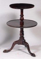Lot 607 - A late Georgian mahogany two tier dumb waiter,...