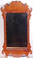 Lot 620 - A 19th century walnut fret carved wall mirror...