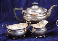 Lot 141 - A George V silver three piece teaset,...