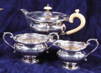 Lot 142 - A Walker & Hall silver three piece teaset,...