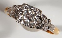 Lot 211 - An 18ct yellow gold and platinum diamond...