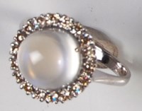Lot 217 - A contemporary 14ct white gold moonstone dress...