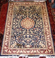 Lot 508 - A Persian Tabriz woollen rug, the blue ground...