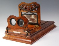 Lot 668 - A Victorian burr walnut stereo graphoscope by...