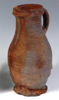 Lot 461 - An English medieval pottery jug, having a...