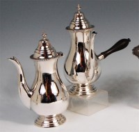 Lot 488 - A pair of George V silver cafe au lait pots,...