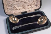 Lot 495 - A matched pair of early George III silver...