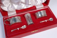 Lot 504 - A cased Garrard & Co three piece cruet set,...