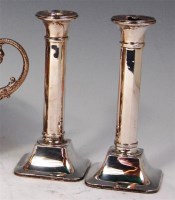 Lot 522 - A pair of George V silver candlesticks, having...