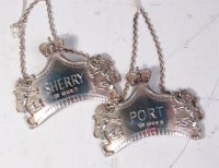 Lot 523 - A pair of commemorative cast silver decanter...