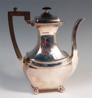 Lot 483 - A George V silver coffee pot, having ebony...