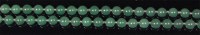 Lot 555 - A beaded and knotted spinach jade single...