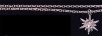 Lot 557 - A 9ct gold long belcher chain with 9ct gold...