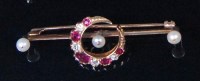 Lot 562 - An early 20th century 15ct gold crescent bar...
