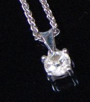 Lot 544 - An 18ct white gold and diamond set pendant,...
