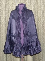 Lot 590 - A Victorian black silk evening cape, with...