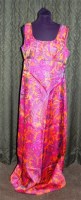 Lot 595 - A 1970s full length printed silk dress, in...