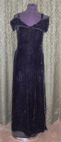Lot 613 - A 1950s black velvet evening dress with cowl...