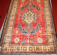 Lot 848 - A Persian Kazak woollen rug, having a red...