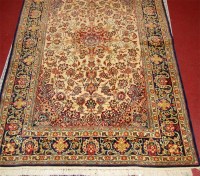 Lot 849 - A Persian fineweave cream ground rug,...