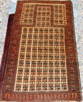 Lot 851 - A Kurdish woollen prayer rug, having a...
