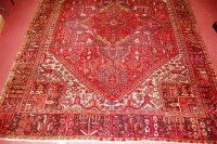 Lot 854 - A Persian woollen Tabriz type carpet, the red...