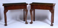 Lot 877 - A pair of George II style walnut hall tables,...