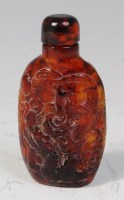 Lot 752 - A 19th century Chinese relief carved amber...