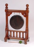 Lot 888 - A late Victorian brass gong suspended in...