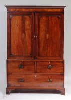 Lot 925 - A late Georgian mahogany linenpress, the upper...