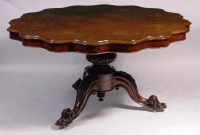 Lot 938 - A Victorian figured walnut pedestal breakfast...