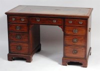 Lot 940 - An Edwardian mahogany kneehole writing desk,...