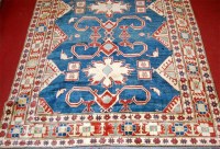 Lot 846 - A Persian Kazak woollen rug, the blue ground...