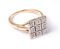 Lot 2517 - An 18ct diamond ring, the nine small round...
