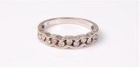 Lot 2518 - A 9ct half hoop diamond ring, the small round...