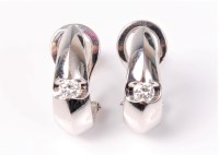 Lot 2550 - A pair of diamond earrings, the teardrop...