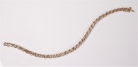 Lot 2557 - A 9ct line bracelet, the small round diamonds,...