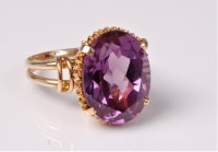 Lot 2561 - A synthetic colour change sapphire ring, the...