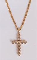 Lot 2567 - An 18ct diamond cross, the round brilliant cut...