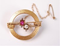 Lot 2577 - A ruby and diamond brooch, the cushion cut...