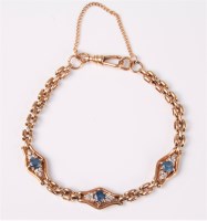 Lot 2590 - A 9ct pale blue synthetic sapphire and diamond...