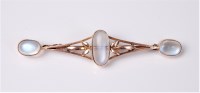 Lot 2609 - A moonstone brooch, the three oval moonstone...