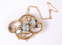 Lot 2621 - An aquamarine brooch, the three oval...