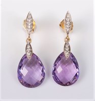 Lot 2663 - A pair of amethyst and diamond earrings, the...
